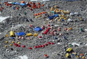 In 2003 scores of tents dotted the slopes of Mount Everest's base camp awaiting their tunr to scale the peak (image Getty Images).